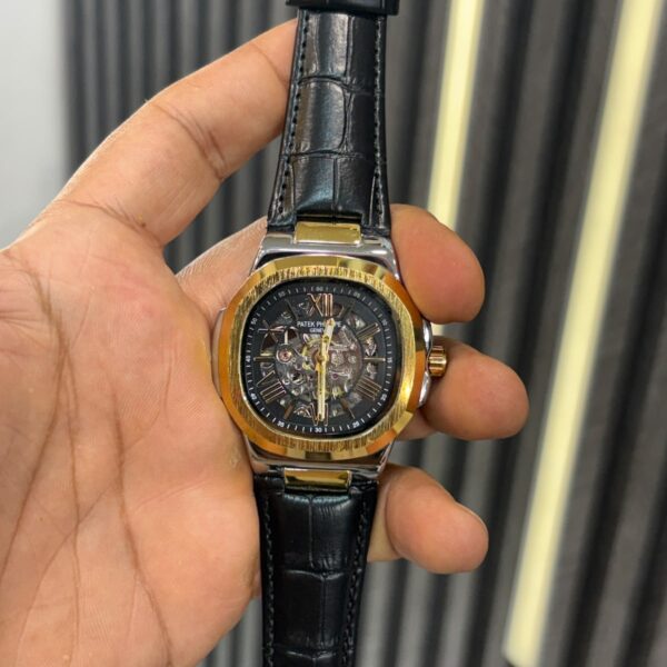 patek golden dial black leather strap