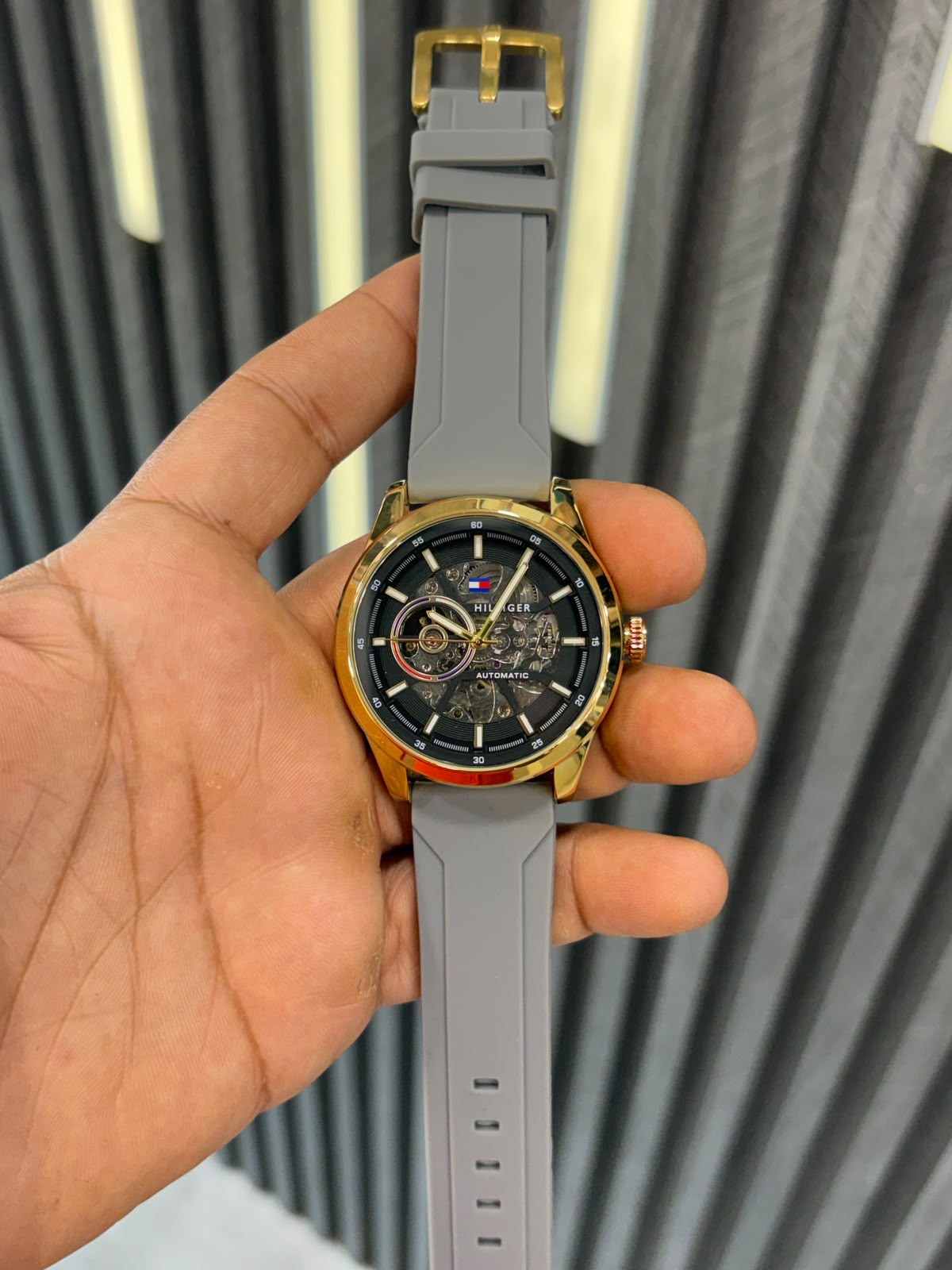 WhatsApp Image 2026-09-23 at 1.17.51 PM TOMMY BLACK GOLDEN DIAL GREY SILICON STRAP - Image 1